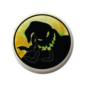 May include: A black and green silhouette of the character Oogie Boogie from the movie The Nightmare Before Christmas. He is depicted with a large grin and bats flying around him. The background is a yellow and green watercolor moon.