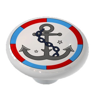 May include: A white ceramic knob with a red, blue, and white striped border. The center of the knob features a gray anchor with a blue chain and two white stars.