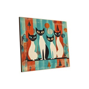 May include: A wooden wall art piece featuring a stylized illustration of four cats. The cats are black and white, with large eyes, sitting on a black line against a background of vertical stripes in teal and orange.