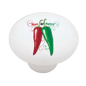 May include: White ceramic knob with a red and green chili pepper design. The text "Hot & Spicy" is written above the peppers.