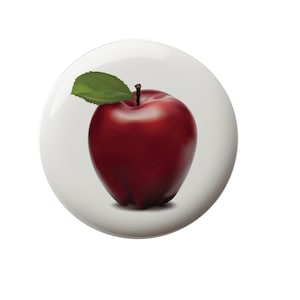 May include: A red apple with a green leaf on a white background.