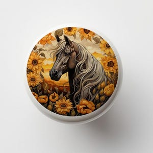 May include: A black horse with a white mane and tail stands in a field of sunflowers. The horse is looking to the left, and the sunflowers are in bloom. The background is a sunset.