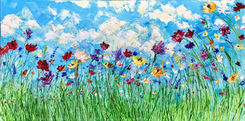 May include: An impressionistic painting of a wildflower meadow under a bright blue sky with fluffy white clouds. The flowers are a mix of red, purple, yellow, and white, with green grass in the foreground. The artwork is a vibrant depiction of nature.