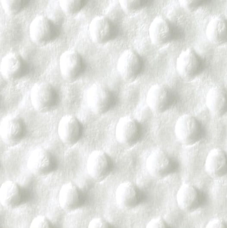 May include: White fabric with a textured pattern of small raised circles.