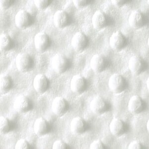 Puede incluir: Tela blanca con un patr&oacute;n texturizado de peque&ntilde;os puntos en relieve.