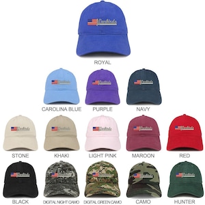 May include: A collection of 12 baseball caps in various colors and patterns, including royal blue, carolina blue, purple, navy, stone, khaki, light pink, maroon, red, black, digital night camo, digital green camo, camo, and hunter. Each cap features a small American flag and the word "Warbirds" embroidered on the front.