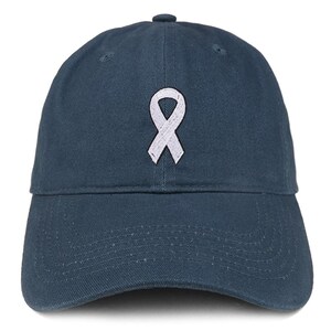 May include: A navy blue baseball cap with a white ribbon embroidered on the front. The cap has a curved brim and a fabric strap with a metal buckle on the back for adjustment. The cap is made of a durable cotton material.