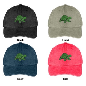 May include: Four denim baseball caps in different colors: black, khaki, navy, and red. Each cap features an embroidered green turtle design.