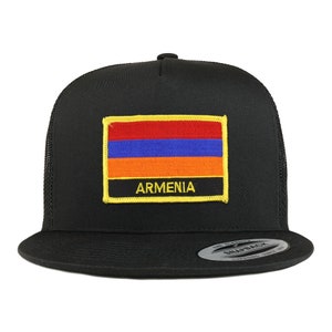 May include: A black trucker hat with a yellow, orange, blue, and red Armenian flag patch and the word "ARMENIA" in yellow lettering.