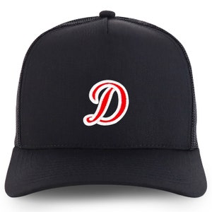 May include: A black trucker hat with a red and white embroidered letter "D" on the front.