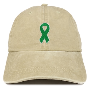 May include: A beige baseball cap with a green ribbon embroidered on the front.