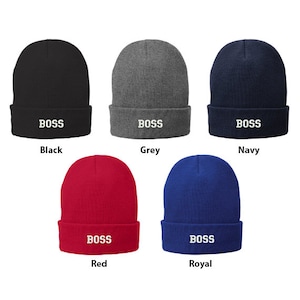 May include: Five knit beanies in different colors, each with the word "BOSS" embroidered in white on the front. The colors are black, grey, navy, red, and royal blue.