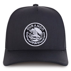 May include: Black baseball cap with a white embroidered logo that says "DURANGO" and features a stylized eagle design.