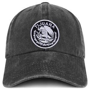 May include: A black denim baseball cap with a white embroidered patch featuring the Mexican coat of arms and the word "TIJUANA".