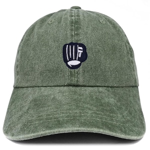 May include: A green baseball cap with a curved peak. The cap has a navy blue embroidered fist design with white details on the front. The cap is made of a soft, textured fabric.