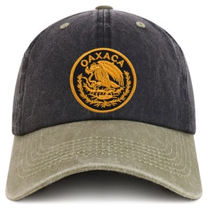May include: A black and green baseball cap with a yellow embroidered emblem featuring an eagle and the text "OAXACA".