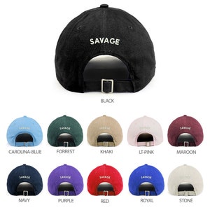 May include: Ten different color baseball caps with the word "SAVAGE" embroidered on the back. The colors are black, carolina blue, forrest green, khaki, light pink, maroon, navy, purple, red, royal blue, and stone.