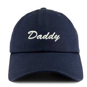 May include: A navy blue baseball cap with white embroidered text that says "Daddy" in a cursive font.