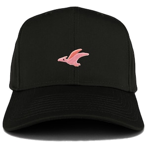 May include: A black baseball cap with a pink pterodactyl embroidered on the front.