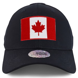 May include: A navy blue baseball cap with the Canadian flag patch. The flag shows a red maple leaf on a white square, set against a red background. The cap has a curved peak and a structured crown. A holographic sticker is on the brim.