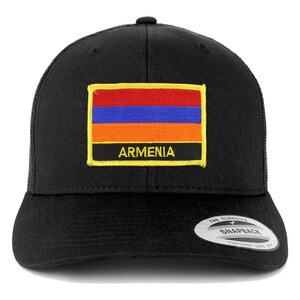 May include: Black trucker hat with a yellow, orange, red, and blue Armenian flag patch and the word "ARMENIA" in yellow letters.