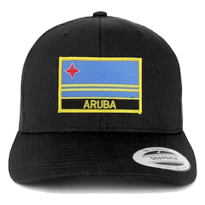 May include: Black trucker hat with a yellow and blue Aruba flag patch. The patch has a red star and the word "ARUBA" in yellow letters. The hat has a black mesh back and a black snap closure. The hat is labeled "The Classics Snapback Yupoong Since 1974".