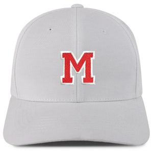 May include: A white baseball cap with a red felt letter "M" embroidered on the front.