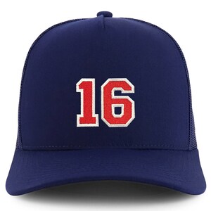May include: A navy blue trucker hat with a red and white embroidered number "16" on the front.