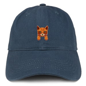May include: A navy blue baseball cap with an embroidered orange cat peeking out from behind the brim.