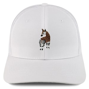 May include: White trucker hat with a brown and black embroidered okapi on the front.