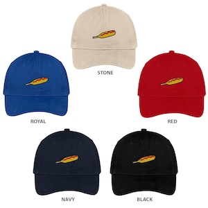 May include: Five baseball caps in different colors with an embroidered image of a corn dog on the front. The colors are stone, royal, red, navy, and black.