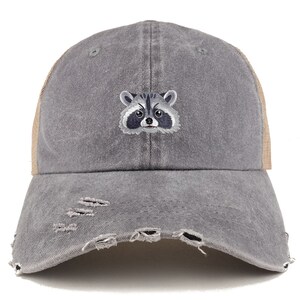 May include: A gray distressed baseball cap with a brown mesh back. The cap features an embroidered raccoon face.
