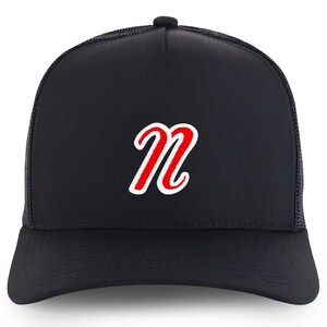 May include: A black trucker hat with a red embroidered letter "N" on the front.
