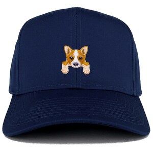 May include: A navy blue baseball cap with an embroidered image of a brown and white puppy peeking out from behind the brim.