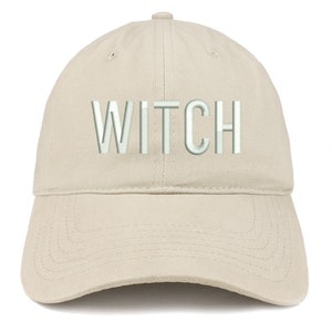 May include: A beige baseball cap with the word "WITCH" embroidered in white on the front.
