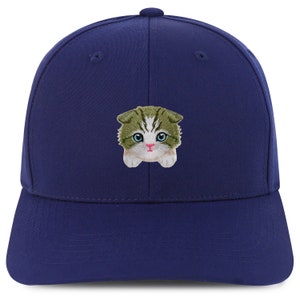 May include: A navy blue baseball cap with an embroidered image of a green and white kitten with pink nose and blue eyes.