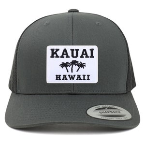May include: A dark gray trucker hat with a white patch that says "KAUAI HAWAII" with palm trees in black.