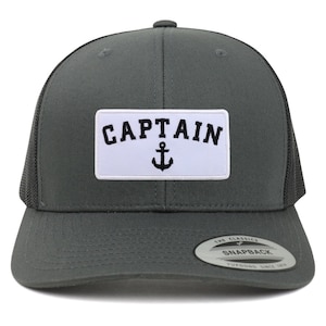 May include: A grey and black trucker hat with a white patch that says "CAPTAIN" with an anchor symbol. The hat has a black mesh back and a grey front.