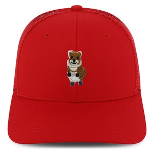 May include: Red mesh trucker hat with a brown and white embroidered cartoon animal on the front.