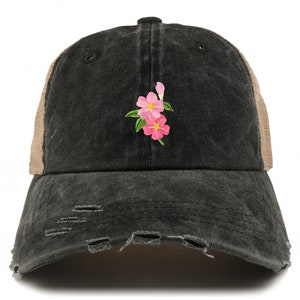 May include: A black and brown distressed trucker hat with a pink flower embroidery.