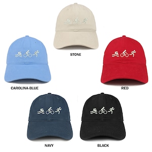 May include: Five baseball caps in different colors with an embroidered triathlon symbol. The colors are stone, carolina blue, red, navy, and black.