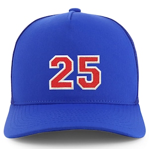 May include: A royal blue trucker hat with a red and white embroidered number "25" on the front.