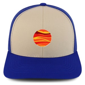 May include: A beige and royal blue trucker hat with a red, orange and yellow abstract design on the front.