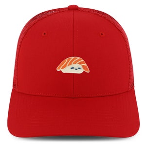 May include: A red mesh trucker hat with a salmon sushi design embroidered on the front.