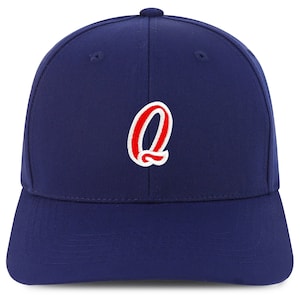 May include: A navy blue baseball cap with a red and white embroidered letter "Q" on the front.