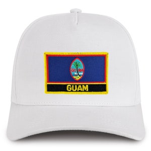 May include: White baseball cap with a blue and red embroidered patch featuring the flag of Guam and the word "GUAM" in yellow.
