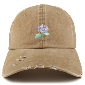 May include: A brown distressed baseball cap with a light blue and purple flower embroidered on the front.