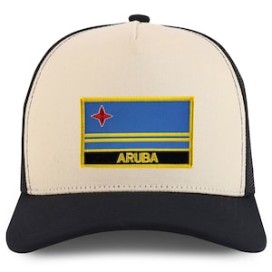 May include: A beige and black trucker hat with an embroidered patch of the flag of Aruba. The patch has a blue background with two yellow stripes and a red star. The text "ARUBA" is written in yellow on a black background below the flag.