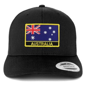 May include: Black trucker hat with a yellow patch featuring the Australian flag and the word "AUSTRALIA" in white text.