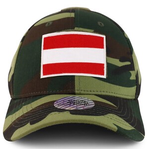 May include: A camouflage baseball cap with a red and white Austrian flag patch on the front. The cap has a curved brim and a mesh back.